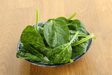 Fresh green spinach leaves in the bowl