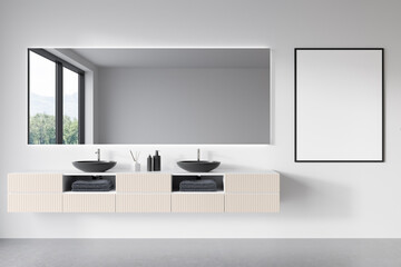 Front view on bright bathroom interior with empty white poster