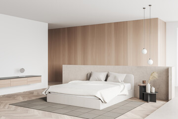 Light bedroom interior with bed on carpet, commode with decoration