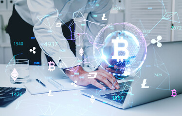 Businessman in formal wear holding smartphone and working on laptop