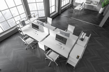 Fototapeta na wymiar Top view on dark office interior with tables with desktops