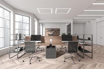 Front view on bright office interior with tables with desktops