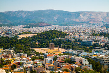 Fototapeta na wymiar Panoramic view on Athens from Acropolis with Temple Columns of Olympian Zeus, Olympieion and mount Hymettus in the background