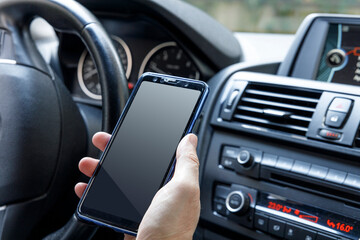 Man using mobile phone in car