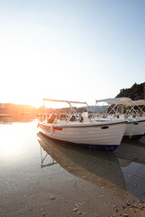 Fototapeta premium boats in the bay of Paleokastritsa at dawn