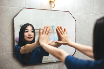 Fototapeta Young adult smile asian woman practice self talk conversation in the morning in bathroom at home. obraz