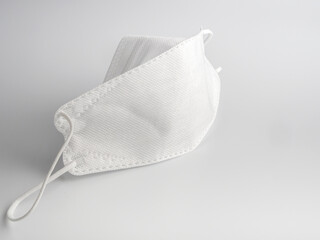 KN94 medical or surgical mask close up on white background.Used to cover the mouth and nose to prevent germs from entering the body.