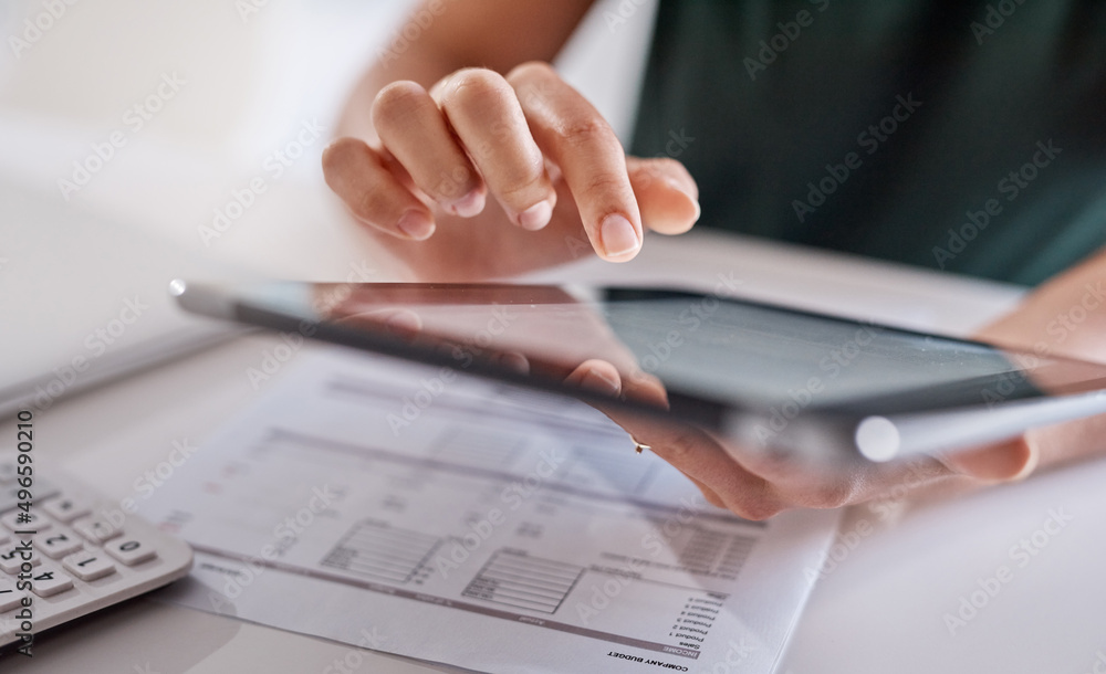 Poster technology greatly assists with all her duties. closeup shot of an unrecognisable businesswoman usin