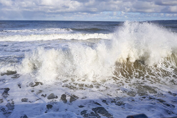 Waves crashing on a sea front in Filey, Yorkshire, UK
