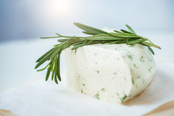 Fresh soft Italian white cheese mozzarella served with fresh rosemary branch
