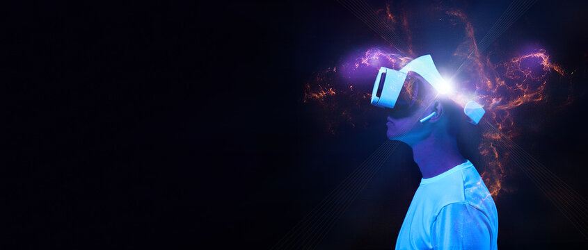 Man is using virtual reality headset. Elements of this image furnished by NASA.