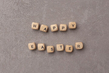 Minimal Easter concept. Text Happy Easter on grey background