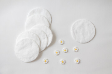 Cotton pad on white background top view.