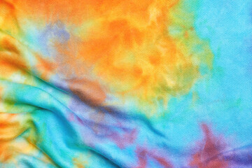 Abstract tie dye multicolor folded fabric cloth Boho pattern texture for background or groovy wedding card, sale flyer, 60s, 70s poster, tie-dye diy backdrop. Modern Watercolor Wet Brush Fabrics Art