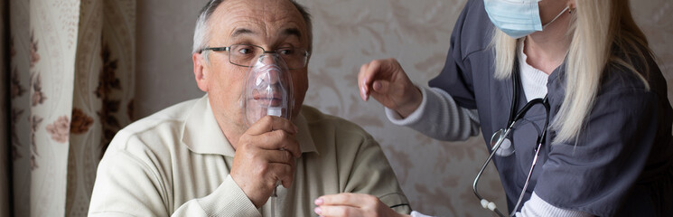 Elderly man on oxygen mask, nebulizer