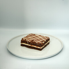 Chocolate cake on white isolated background.