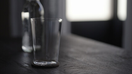 tonic water with tumbler glass on wood table