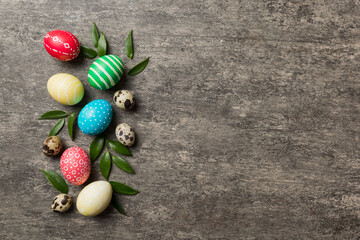 Colorful Easter eggs with spring flower leaf isolated over white background. Colored Egg Holiday border