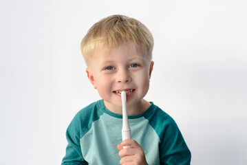 boy brushing his teeth