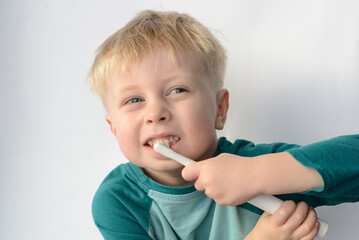 boy brushing his teeth