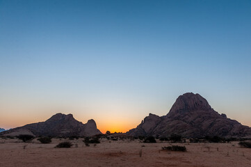 Impression of the Rocky Namibian Desert near Spitzkoppe during the golden hour around sunset.