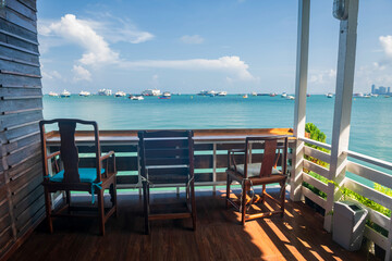 table and chairs of coffee cafes by sea in summer at Pattaya