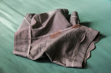 The gray shorts were stained with blood.