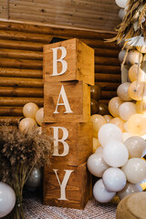 Baby text. Birthday decorations - balloons, garland and decor for little baby party on a wall...