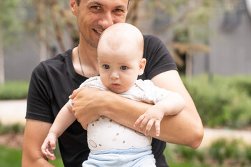 Fototapeta premium baby boy outdoor playing with father.