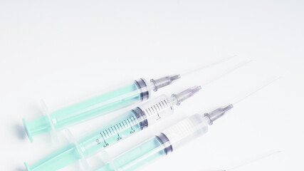 medical disposable plastic syringe for injection in the hospital isolated on a white background