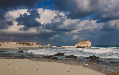 Windy and Rocky Coastline of the Mediterranean Sea in the Marsa Matruh city under Blue Cloudy sky...