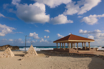 Windy and Rocky Coastline of the Mediterranean Sea in the Marsa Matruh city under Blue Cloudy sky with no People around, Egypt