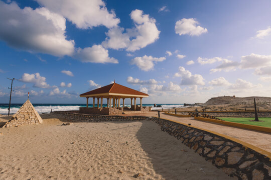 Windy and Rocky Coastline of the Mediterranean Sea in the Marsa Matruh city under Blue Cloudy sky with no People around, Egypt