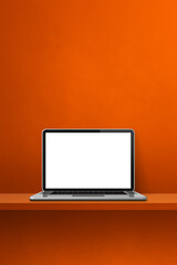 Laptop computer on orange shelf. Vertical background