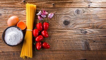 Composition with dried spaghetti, and pasta ingredients