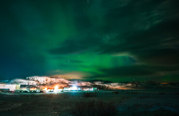 Landscape. The Northern lights in the sky beyond the Arctic Circle.