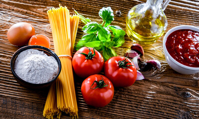 Composition with dried spaghetti, and pasta ingredients