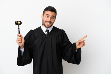 Judge caucasian man isolated on white background pointing finger to the side