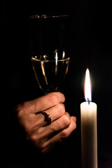 Engagement ring wine glass and candle