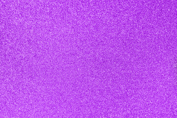 Violet glitter twinkle abstract winter or Christmas holiday background with sparkles. Modern luxury mock up with sequins. Texture of colored porous rubber with spangles