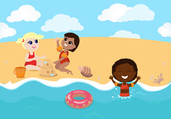 Obraz na płótnie Canvas Children of different nationalities play on the beach, the girls built a sand castle and decorate it. The child swims in the sea in armlets and with an inflatable ring. All children are happy at sea.