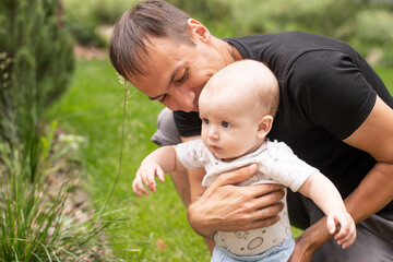 Fototapeta premium Summer portrait of beautiful baby on the lawn