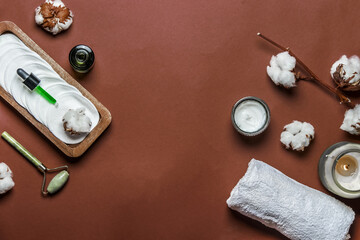 Sustainable beauty setting with eco-friendly products: reusable cosmetic pads, jade massage roller,...