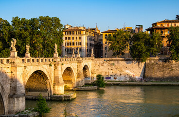 Panoramic view of Tiber river and Lungotevere Tor di Nona embankment aside Ponte Sant'Angelo Saint Angel Bridge in historic city center of Rome in Italy © Art Media Factory