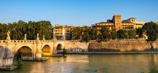 Panoramic view of Tiber river and Lungotevere Tor di Nona embankment aside Ponte Sant'Angelo Saint Angel Bridge in historic city center of Rome in Italy © Art Media Factory
