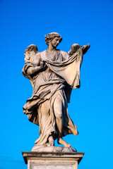 Angel with the Sudarium Veronica Veil statue by Cosimo Fancelli on Ponte Sant'Angelo Saint Angel Bridge over Tiber river in historic center of Rome in Italy
