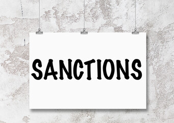 The word sanctions is written on notebook. Political and economic concept