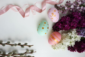 greeting card layout. bouquet of spring flowers, willow twigs and colorful Easter eggs