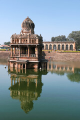Fototapeta premium 18 December 2021, Santhebennur, Karnataka, India, Musafirkhana and Honda, The large pond (Honda) has its sides veneered with granite steps. Beautiful columns and arches grace the building's interior.