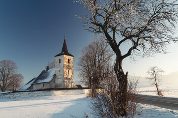 Fototapeta na wymiar Winter landscape with countryside church.